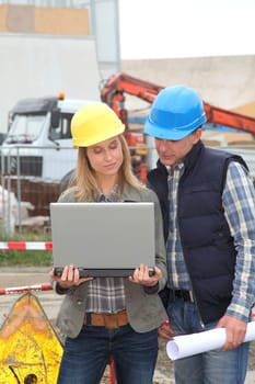 Architect and engineer on construction site