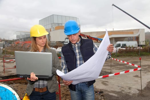 Architect and engineer on construction site