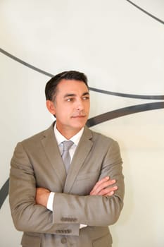 Portrait of businessman standing in hall
