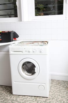 Closeup of washing machine in laundry