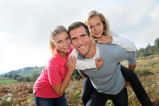 Happy family having fun in the countryside