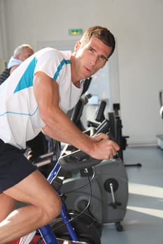 Closeup of man working out in gym