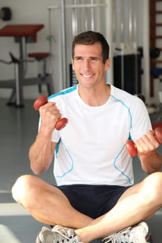 Closeup of man working out in gym