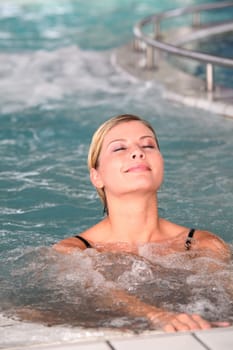 Closeup of beautiful woman in spa center