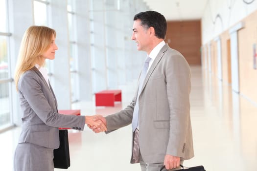Business partners meeting in modern building