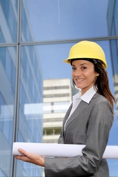 Woman engineer in front of modern building