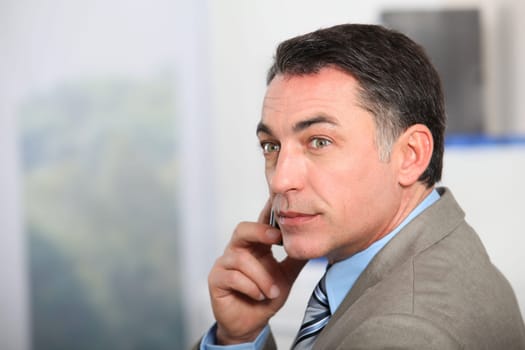 Closeup of businessman talking on the phone
