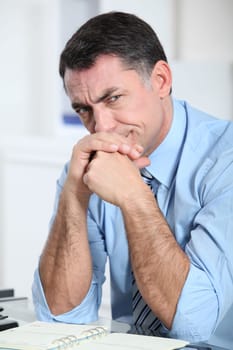 Businessman in the office working hard on project