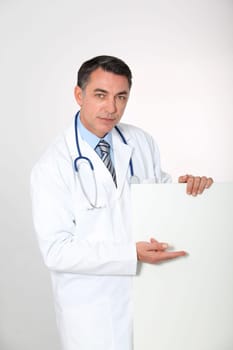 Doctor showing white board