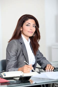 Closeup of smiling real estate agent in office