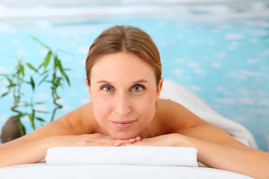 Closeup of beautiful blond woman on a massage bed