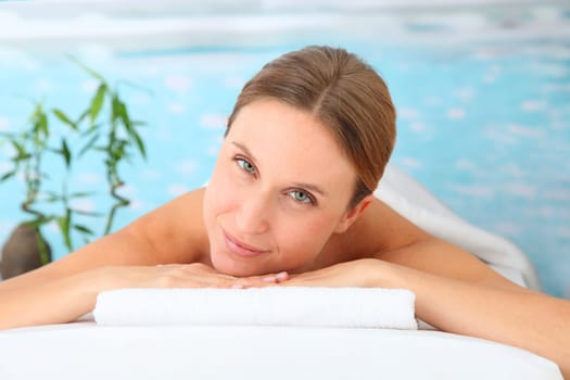 Closeup of beautiful blond woman on a massage bed