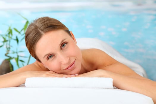 Closeup of beautiful blond woman on a massage bed