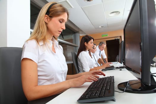 Blond businesswoman with headset on