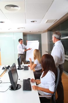 Group of people attending business presentation