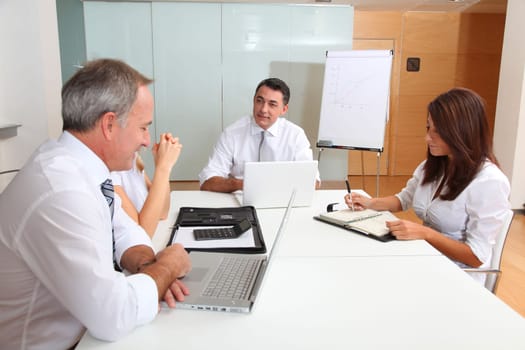 Business people meeting around table
