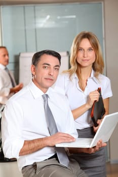 Manager and saleswoman meeting in the office