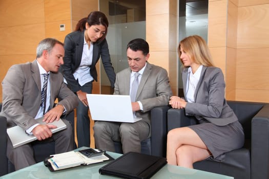 Group of associates meeting in lounge