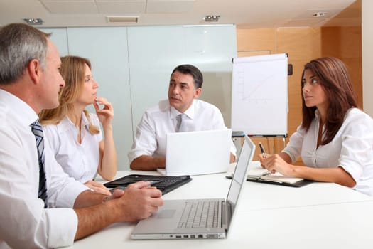 Business people meeting around table