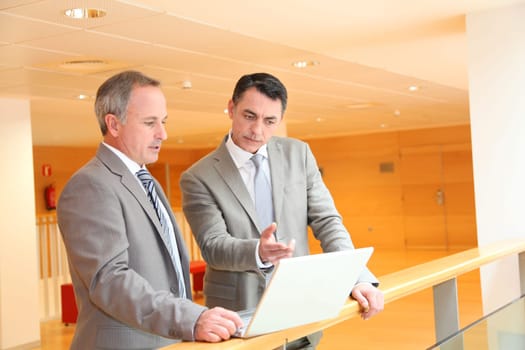 Business partners meeting in lobby