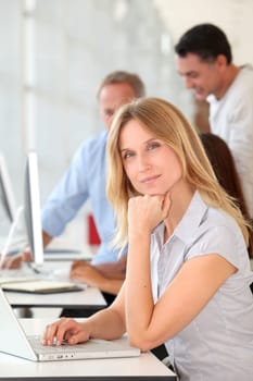Beautiful woman working in the office on laptop computer
