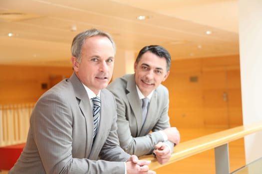 Business partners meeting in lobby