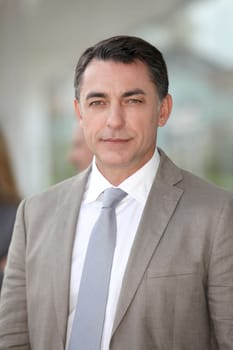 Businessman standing outside modern building