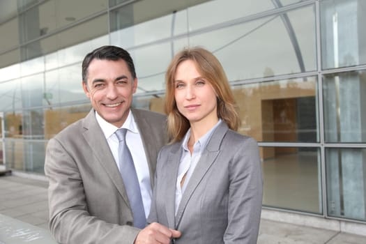 Sales people working outside modern building