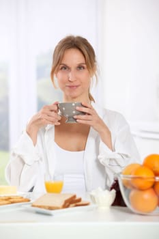 Woman having breakfast in the morning