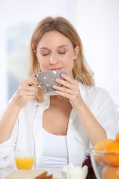 Woman having breakfast in the morning