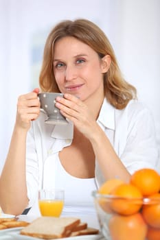 Woman having breakfast in the morning
