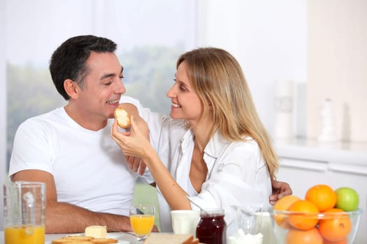 Couple having breakfast during the week end