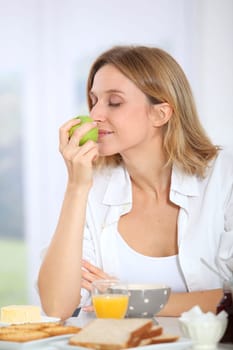 Woman having breakfast in the morning