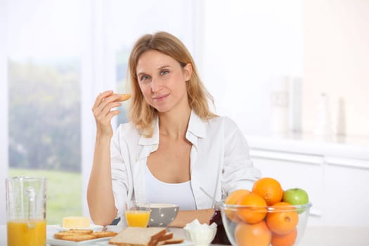 Woman having breakfast in the morning