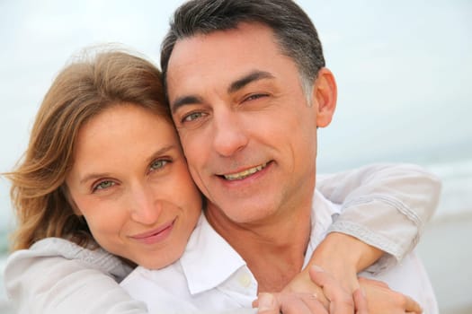 Couple embracing each other at the beach