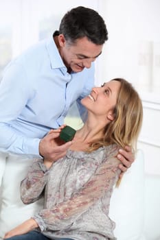 Man giving a present to woman