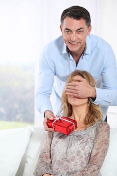 Man giving a present to woman
