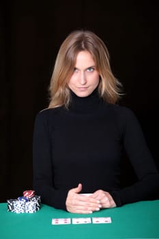 Woman sitting at poker table