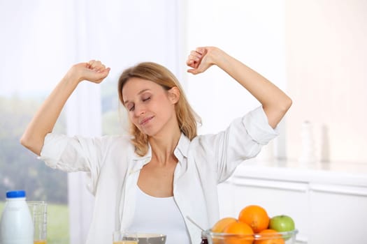 Woman having breakfast in the morning