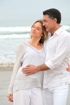Couple walking by the beach