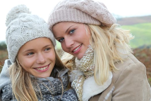 Closeup of mother and daughter in fall