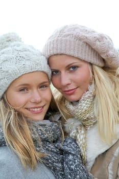 Closeup of mother and daughter in fall