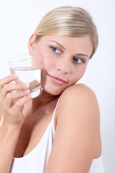 Closeup of woman holding glass of water