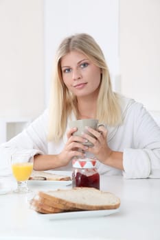 Closeup of beautiful woman havig breakfast