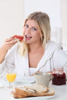 Closeup of beautiful woman havig breakfast