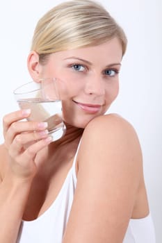 Closeup of woman holding glass of water