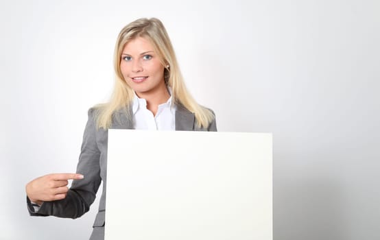Businesswoman holding white panel