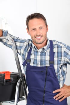 Electrician changing lamp bulb