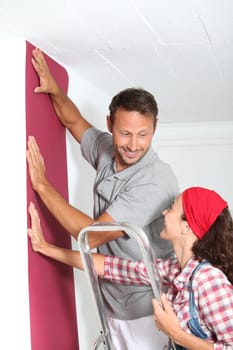 Couple choosing color of new paperwall