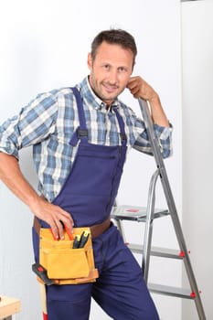 Electrician changing lamp bulb